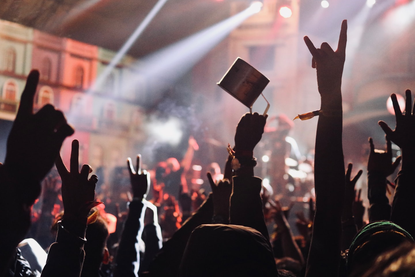 Hands raised in the air at a music festival.